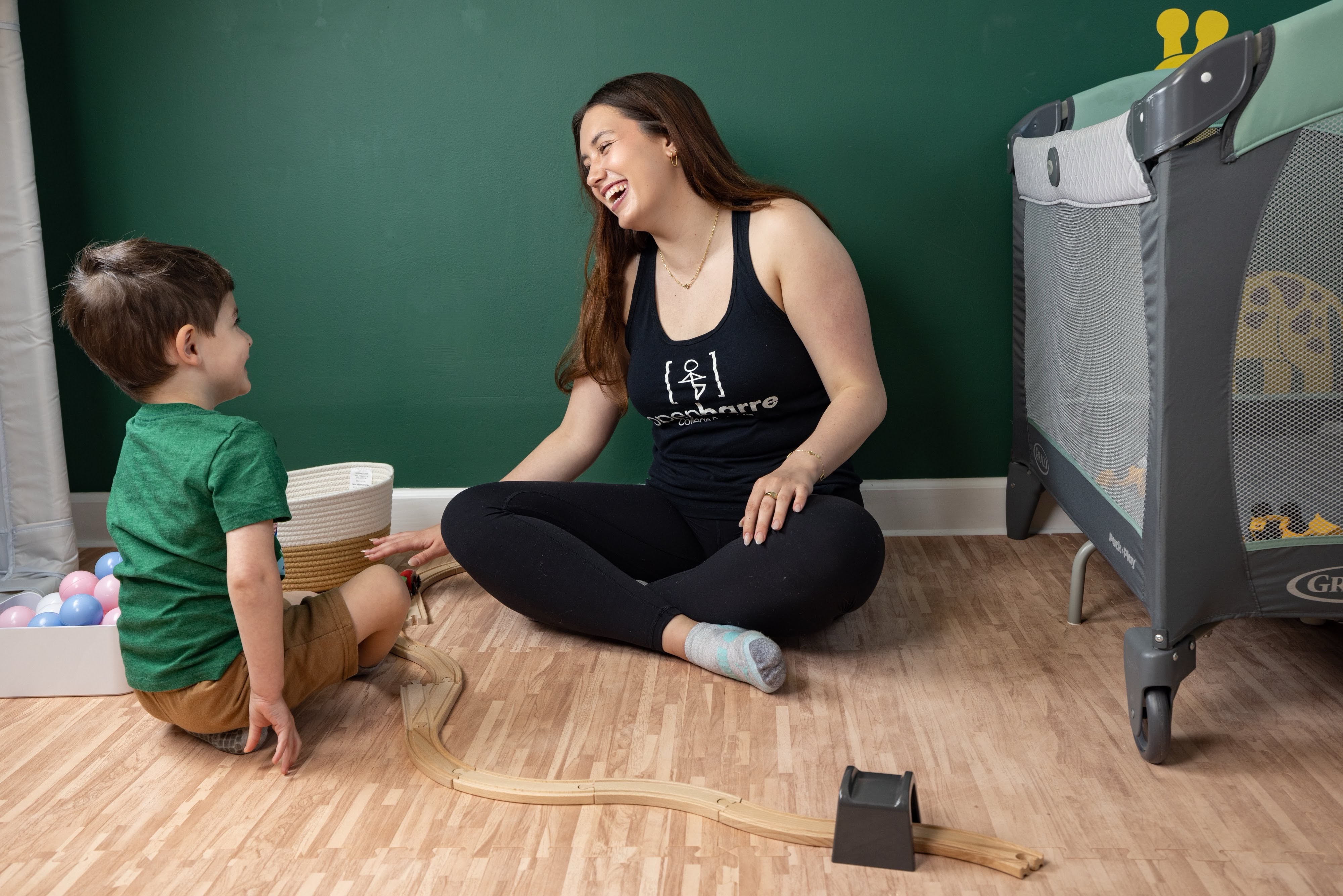 kids teacher laughing with child babysitting